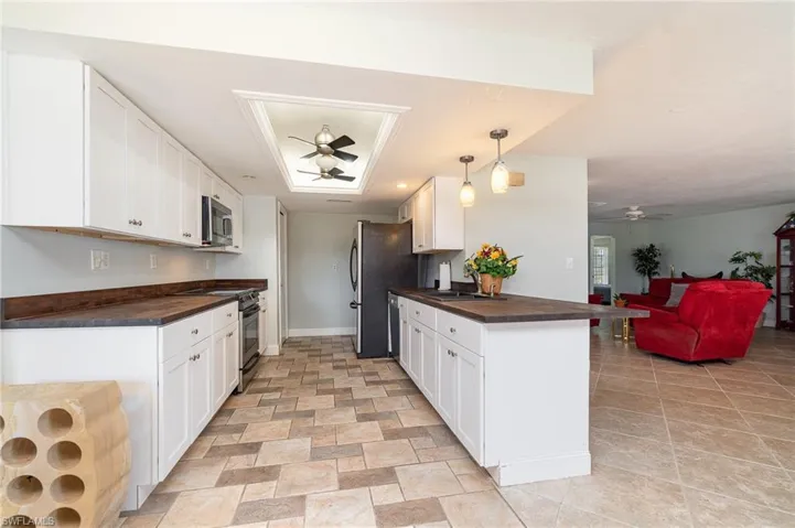 A long 16' x 6' kitchen with plenty of cabinets