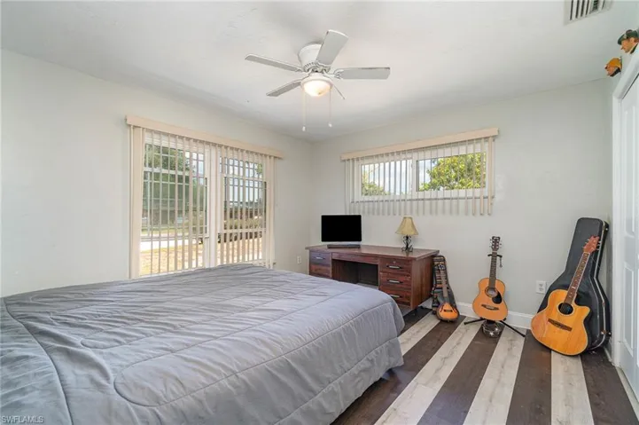 The 1st of the 2 guest bedrooms with super cool & unique LVT flooring
