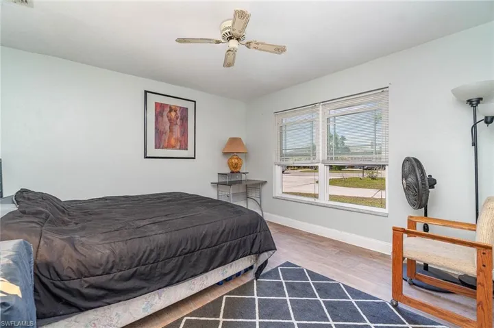 The 2nd of the 2 guest bedrooms with wood grain LVT flooring