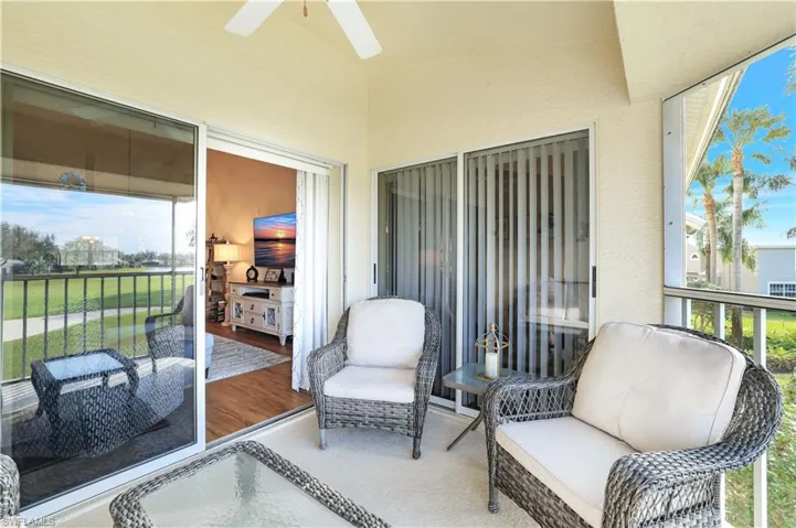 Sunroom featuring a ceiling fan