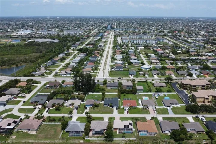 Aerial view from the backyard vantage point with an eastern directional view of Cape Coral