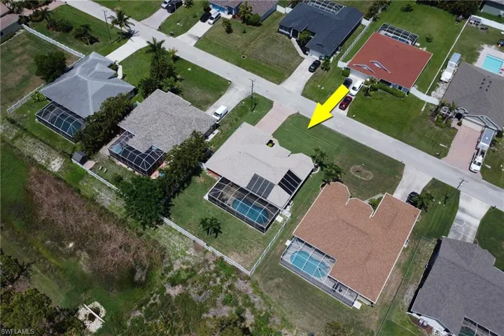 Aerial view of the home and backyard
