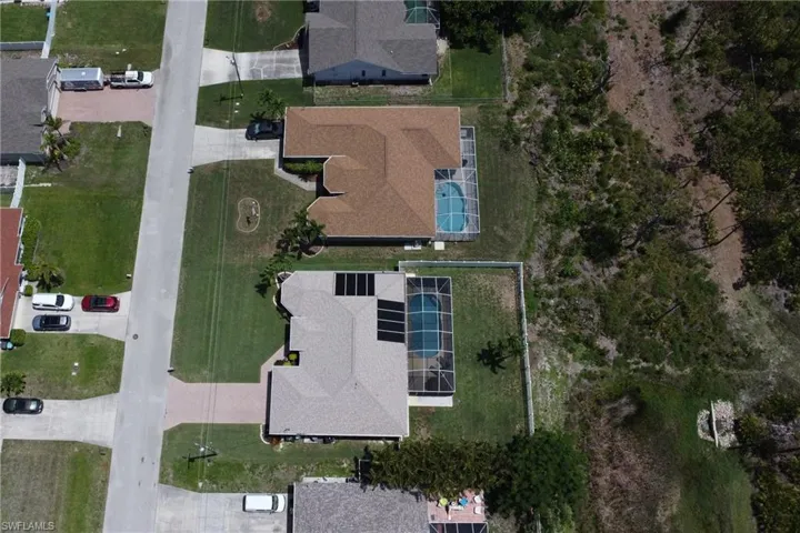 View of the home, backyard, and portion of Joe Coviello Park