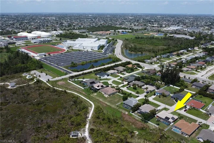 Aerial view of the property's backyard, nature preserve Joe Coviello Park, and high school Ida S. Baker
