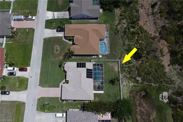 View of the home, backyard, and portion of Joe Coviello Park