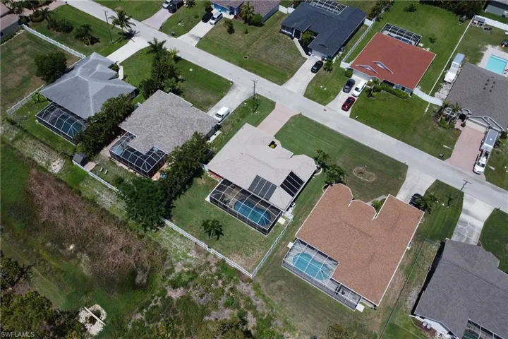 Aerial view of the home and backyard