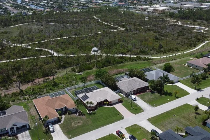Aerial view of home, the backyard view is of nature preserve Joe Coviello Park
