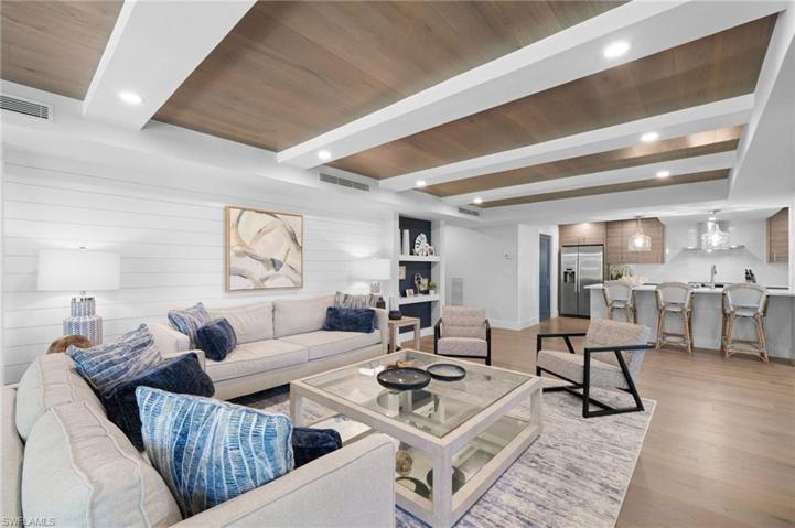 Impressive ceiling treatments punctuated by white lighted beams