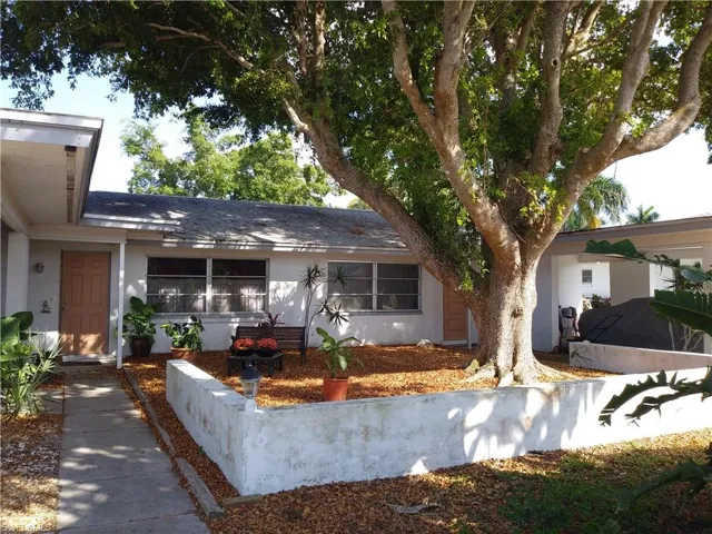 Ranch-style house with stucco siding