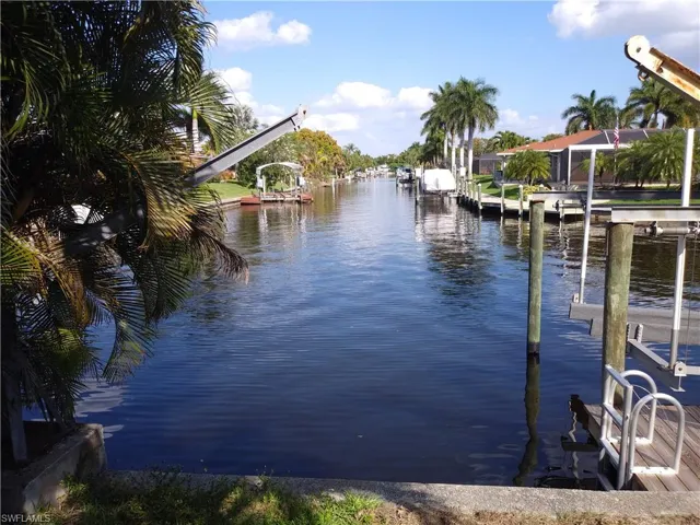 Dock featuring a water view and boat lift