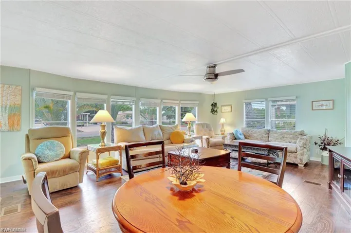 Large front living/dining with a wall of windows