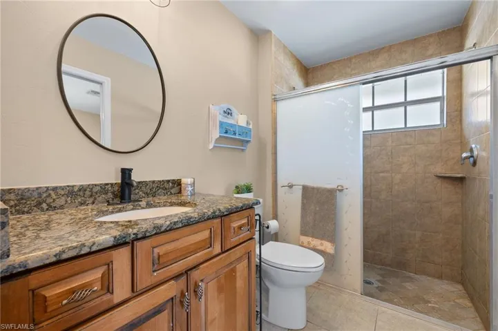 10679- Walk in shower duplex side with pocket door to bedroom and access from great room
