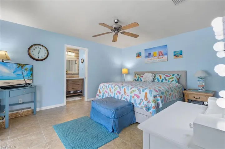 10681- Primary bedroom with large closet and walks out to pool area