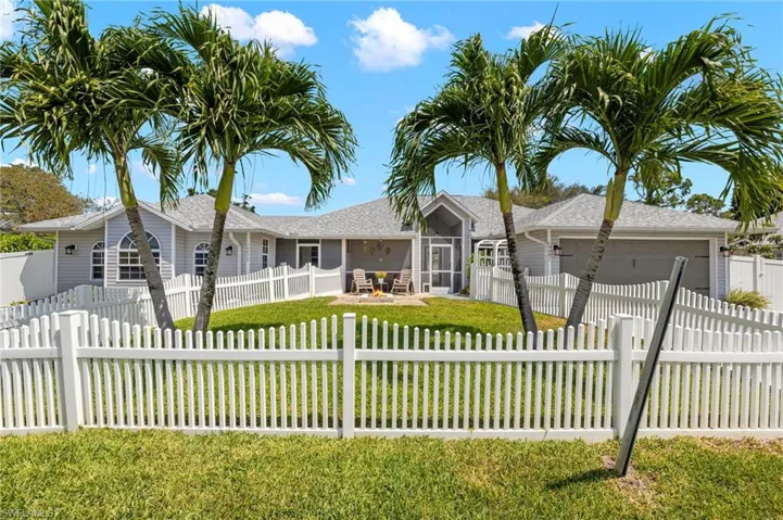 Duplex or multifamily home with beautiful front yard and fiirepit
