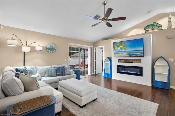 10681- Walk out to pool and entrance to Primary from family room with vaulted ceilings