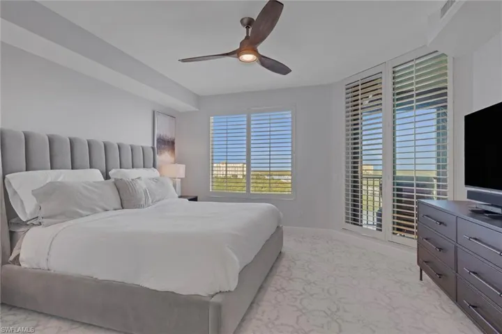 Bedroom featuring a ceiling fan and baseboards