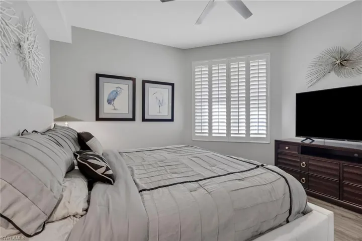 Bedroom featuring a ceiling fan and light wood finished floors