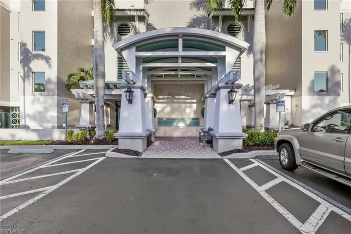 View of exterior entry featuring stucco siding and uncovered parking
