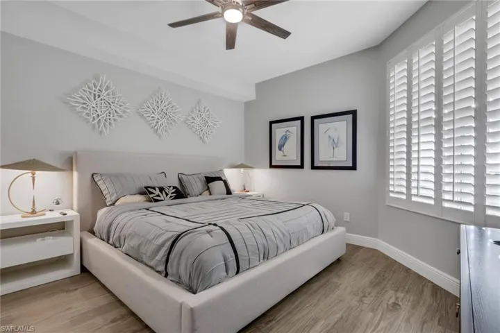 Bedroom with light wood finished floors and ceiling fan