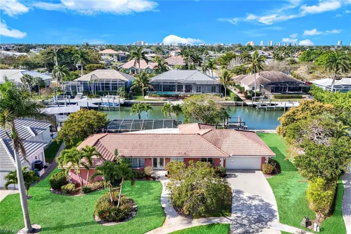 Aerial view of residential area with a large body of water