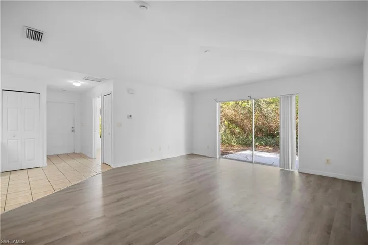 Unfurnished room featuring light wood-style flooring and baseboards