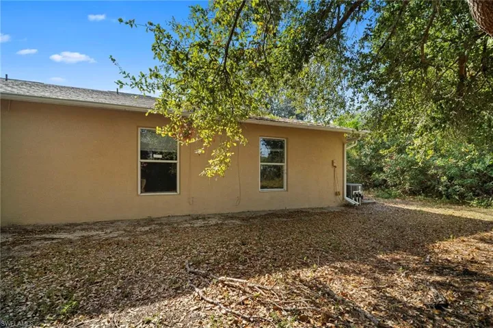 View of side of property with stucco siding