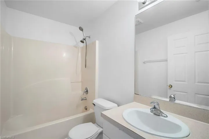 Full bath featuring vanity and shower / bathtub combination