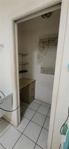 Bathroom with light marble finish floors