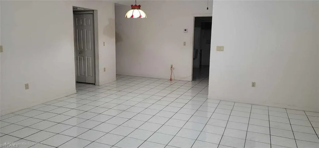 Spare room with light tile patterned floors