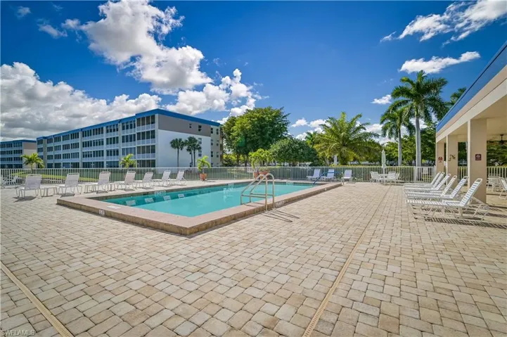 Community pool featuring a patio area