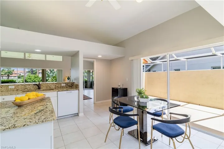 Dining room featuring tile flooring, sink, and ceiling fan