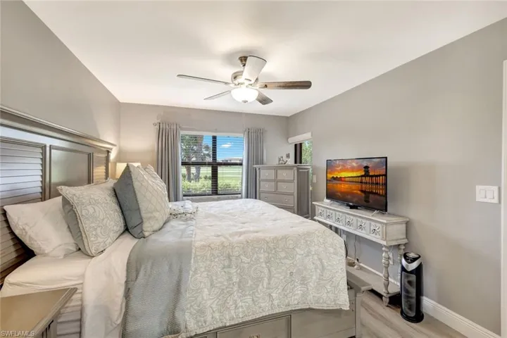 Bedroom featuring light wood-type flooring and ceiling fan
