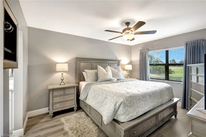 Bedroom featuring ceiling fan and wood-type flooring