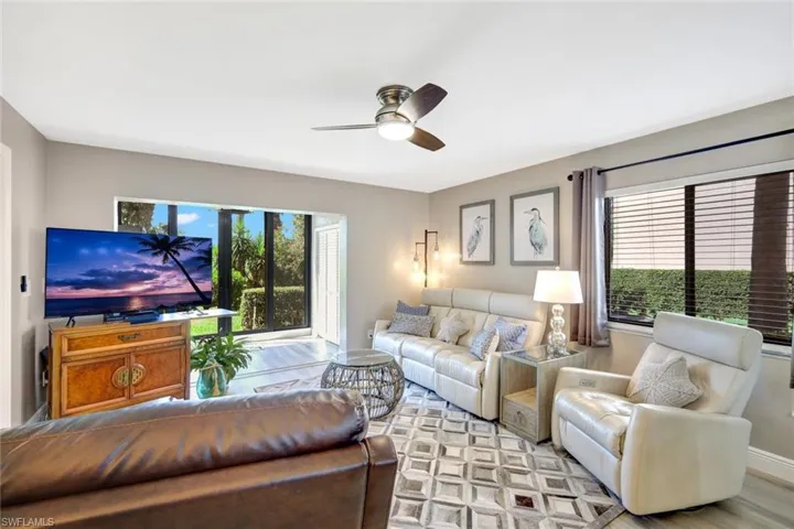 Living room with plenty of natural light and ceiling fan