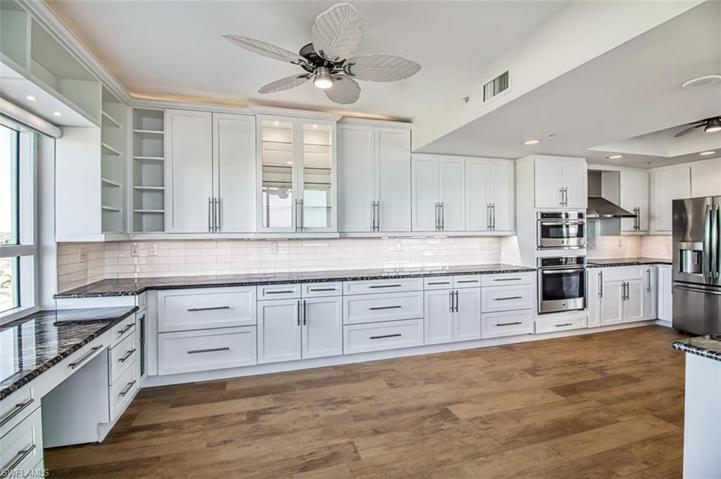 Kitchen with loads of storage and built in desk