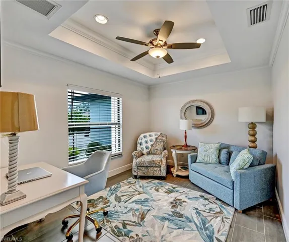 Den/Office featuring crown molding, ceiling fan, recessed lighting, and a tray ceiling