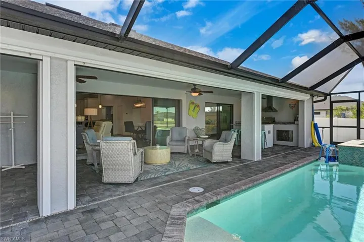 Rear view of enclosed entertaining and pool patio area
