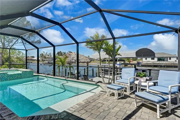 Combined pool / hot tub with canal water view and sun spot to relax