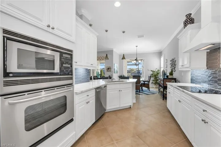 Fully remodeled kitchen with stunning backsplash and counter height tops