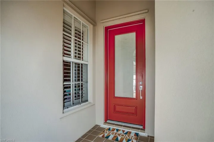 Entrance to property featuring stucco siding