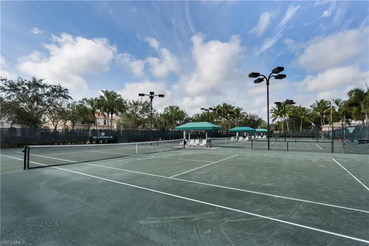 View of tennis court with fence