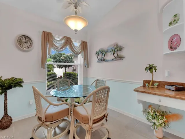Dining room with baseboards and light tile patterned flooring