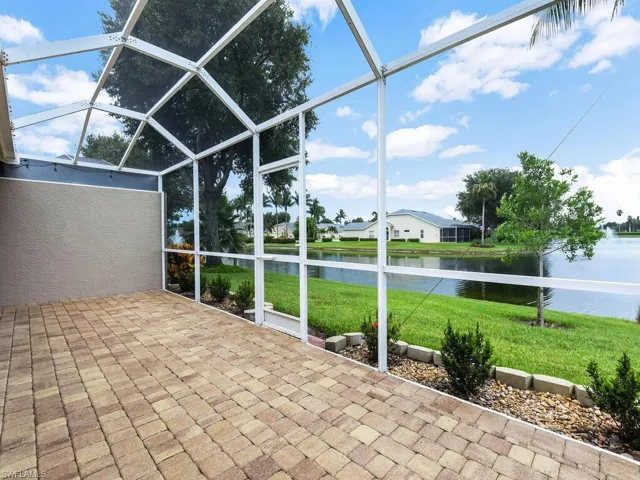 Unfurnished sunroom featuring a water view