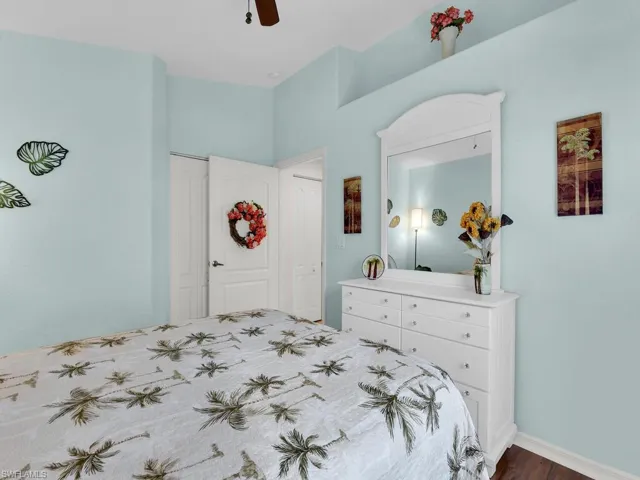 Bedroom featuring dark wood-style floors and ceiling fan