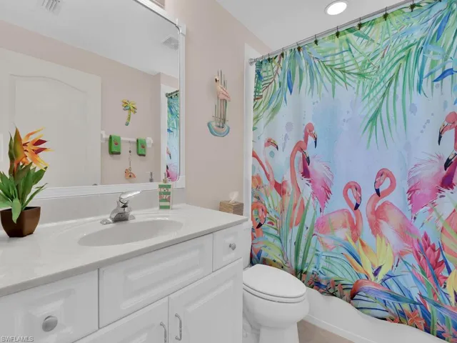 Bathroom featuring vanity and shower / tub combo