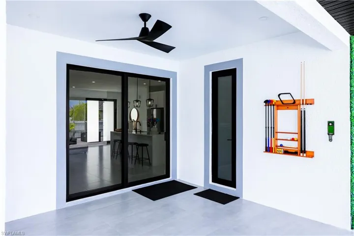 Entrance to property with a ceiling fan
