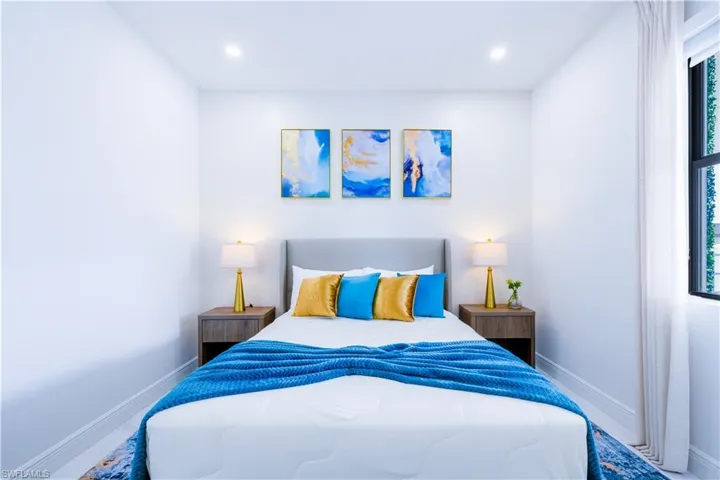 Bedroom featuring multiple windows