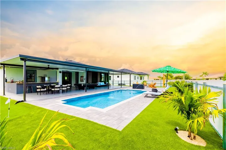 View of pool with a fenced backyard, a ceiling fan, a patio area, an outdoor living space, and outdoor dining area