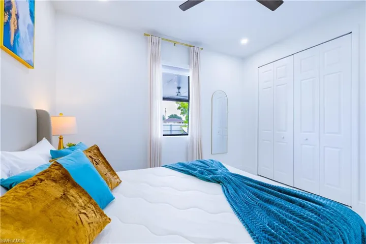 Bedroom with a closet, a ceiling fan, and recessed lighting