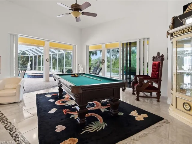 Playroom with pool table, healthy amount of natural light, and a ceiling fan